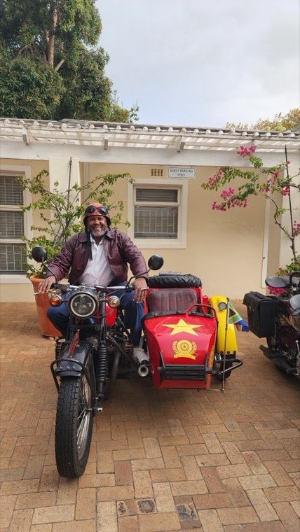 An MDV traveler preparing for a vintage sidecar tour in Cape Town.