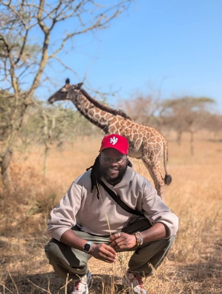 Nick with a giraffe at Serval Wildlife