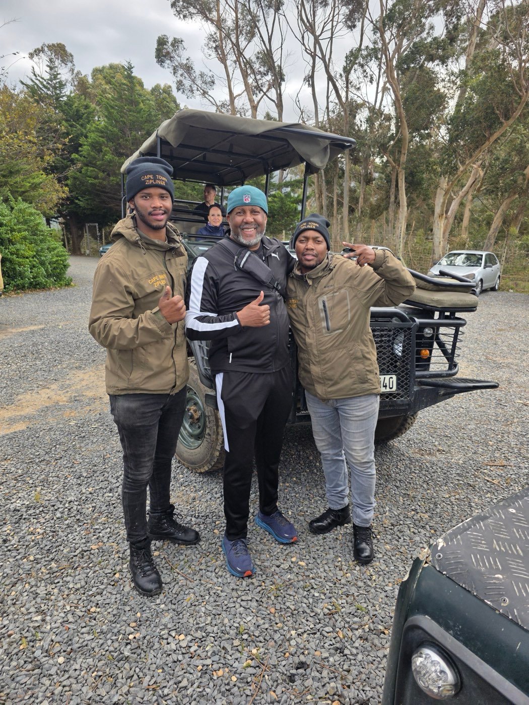Norman with local Cape Town guides beside an open-air vehicle