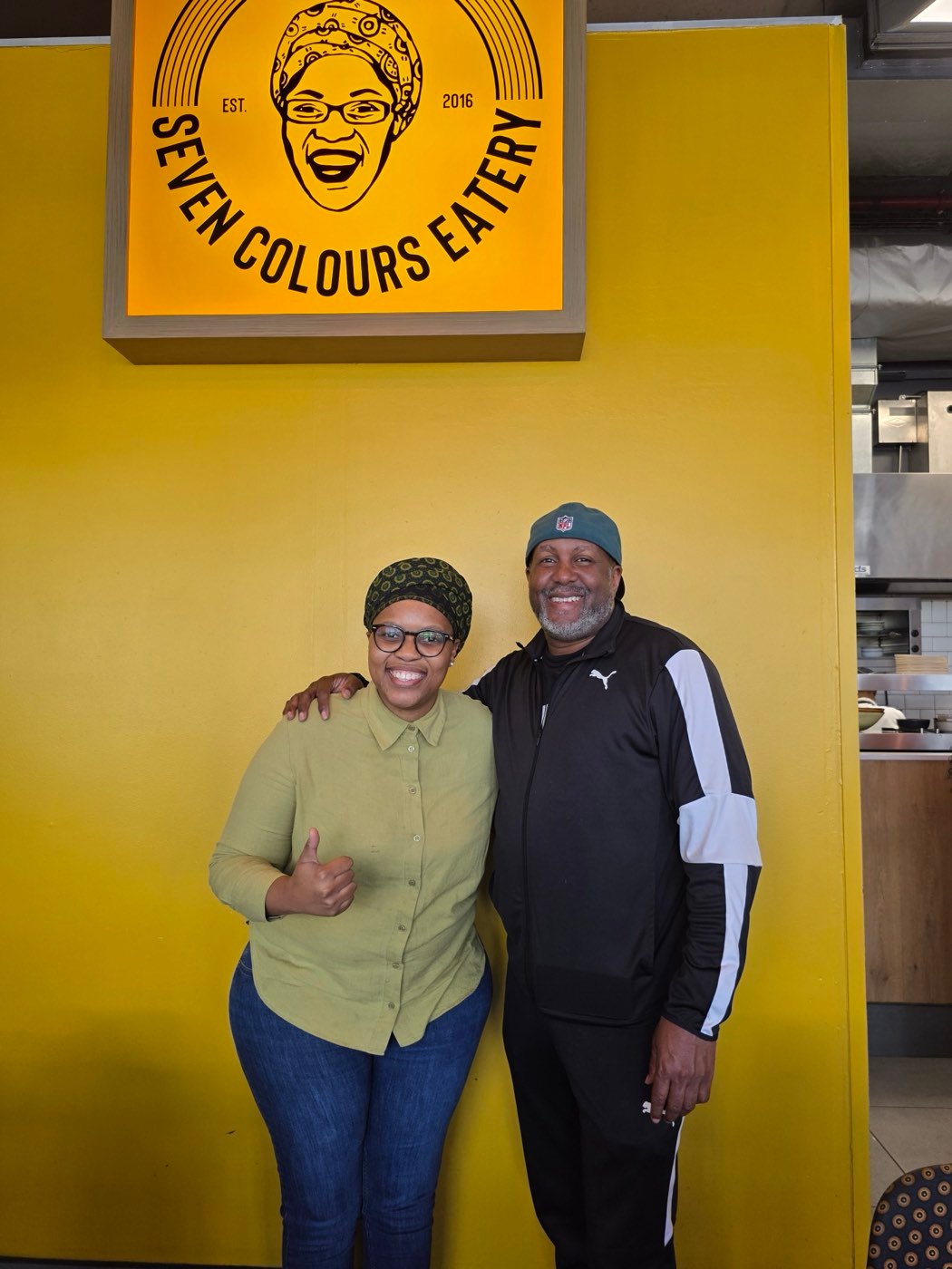 Norman with a host at Seven Colours Eatery